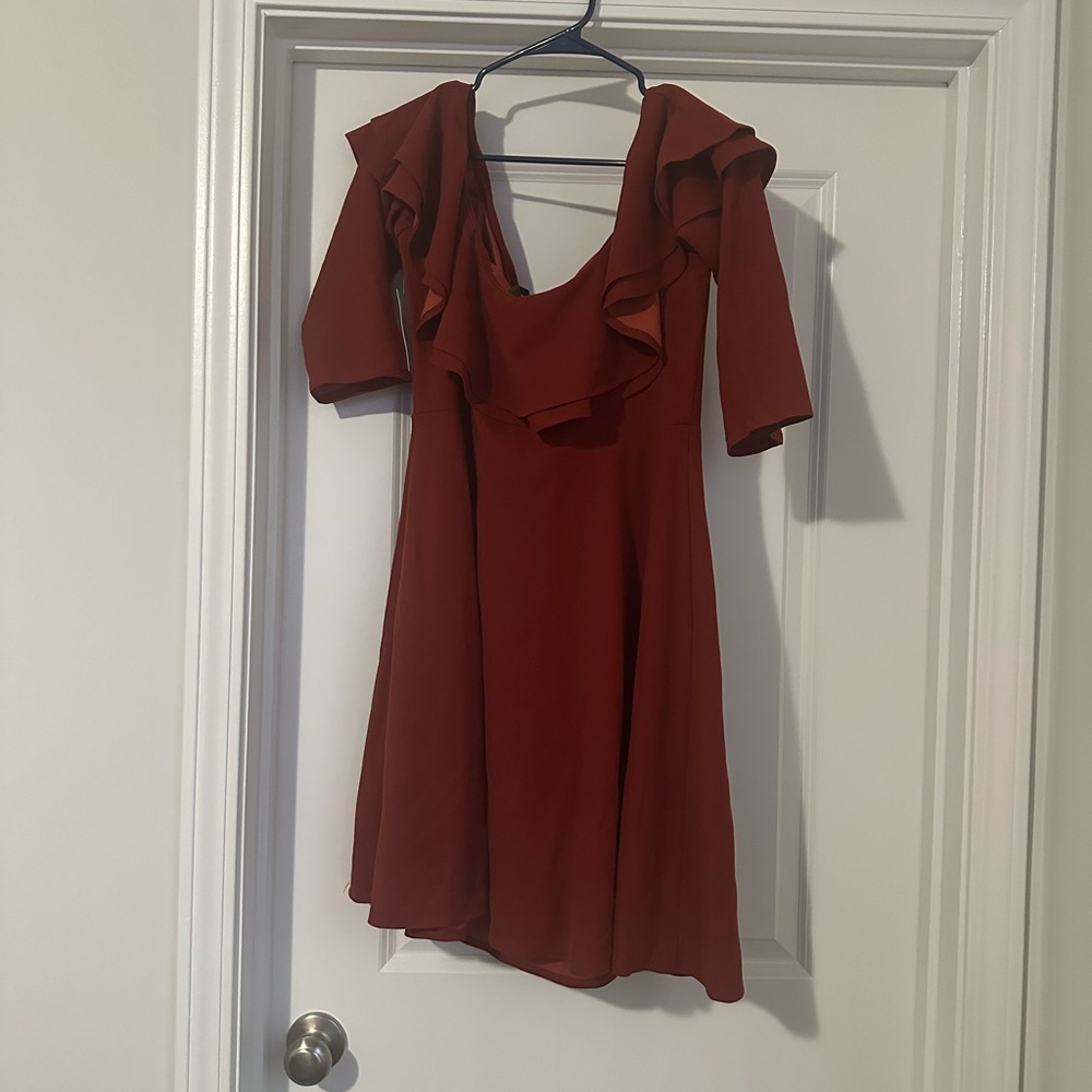 Cute off the shoulder burnt orange dress .